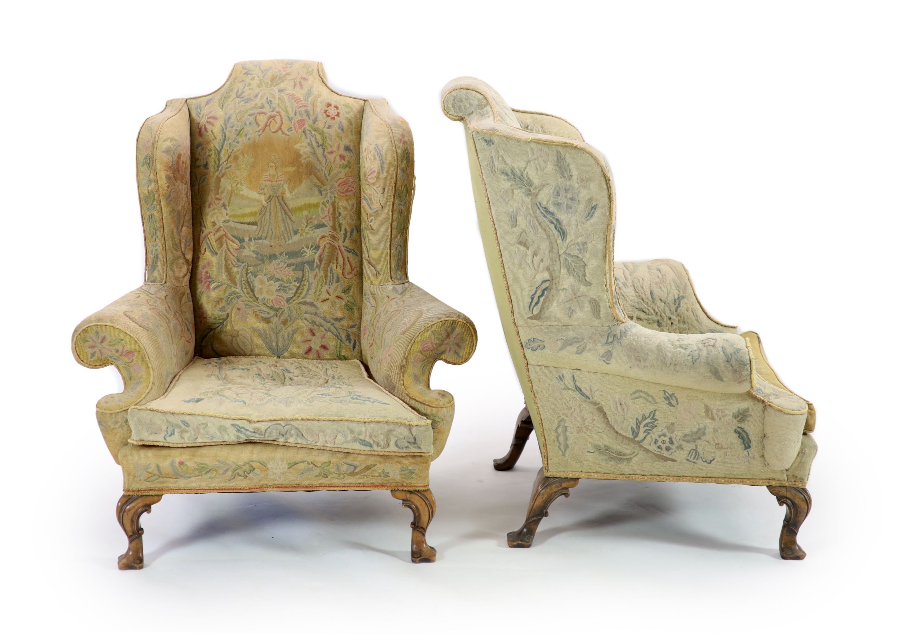 A pair of Georgian style mahogany wing armchairs W.104cm D.96cm H.120cm